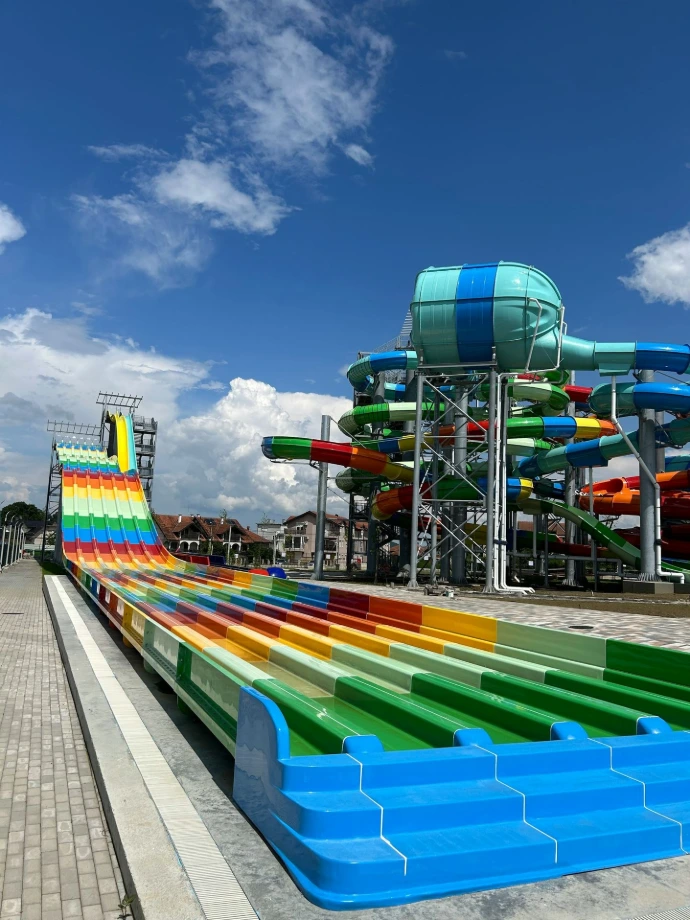 a water park with a water slide and slides